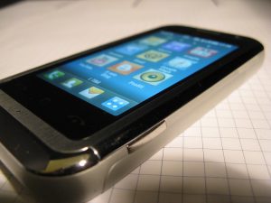 UK App Development phone with apps